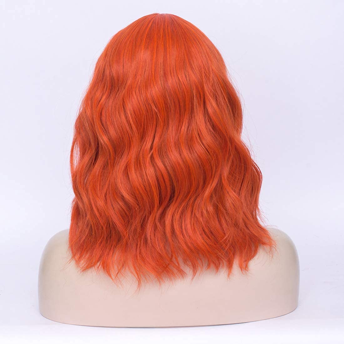 WGPFWIG Women's Light Orange Wig Short Curly Wavy Wig Shoulder Length Flat Bangs Wig For Women Girl Cosplay Party Halloween Wig Cap Included (Light Orange)