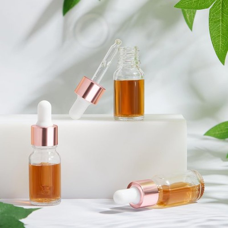 Didaey 100 Pcs Mini Glass Dropper Bottle Bulk, 10 ml Rose Gold Clear Essential Oil Dropper Bottles Small Tincture Empty Bottles Sample Containers Perfume Liquid Vials with Cap for Traveling