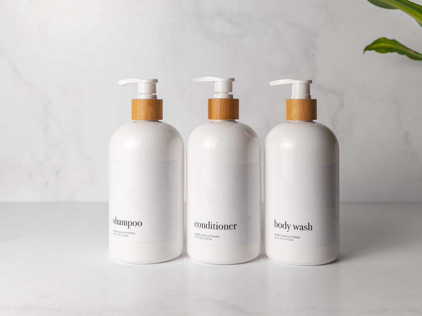 Heartland Lettering Shampoo and Conditioner Dispenser - Modern Refillable Shower Soap Container Set of 3, Plastic Bottles with Waterproof Labels, White Empty Bottle & Bamboo Pumps