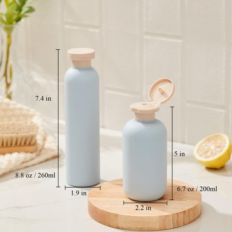 Qeuly Squeeze Bottles with Pump Dispenser and Flip Cap, 8.8 oz Refillable Travel Containers for Toiletries, Plastic Travel Shampoo and Conditioner Bottles (Blue 260)