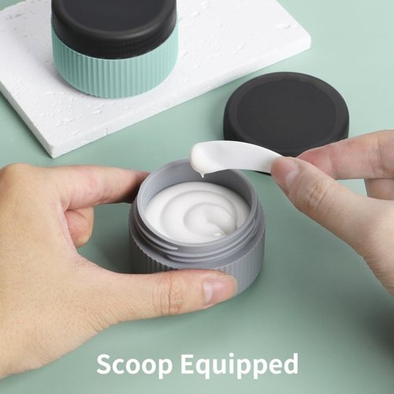 ME.FAN Travel Containers for Toiletries, TSA Approved 1.5 oz Silicone Cream Jars, Leak-proof Travel Size Containers, Travel Accessories for Cosmetic Face Hand Body Cream 4 Pack Black Lid - Grey