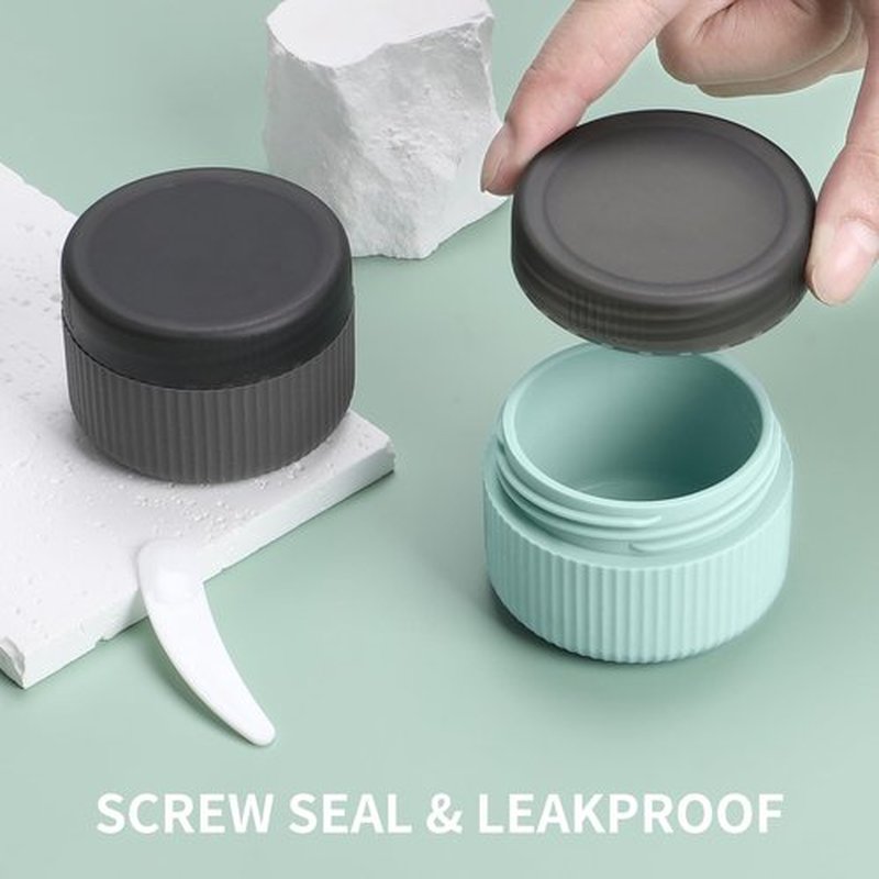 ME.FAN Travel Containers for Toiletries, TSA Approved 1.5 oz Silicone Cream Jars, Leak-proof Travel Size Containers, Travel Accessories for Cosmetic Face Hand Body Cream 4 Pack Black Lid - Grey