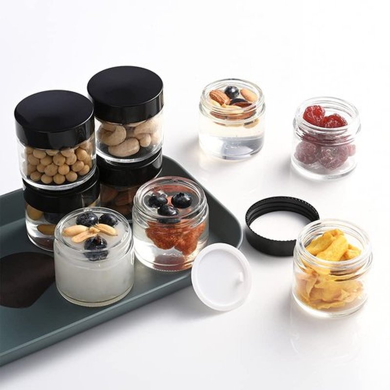 1 oz Round Clear Glass Jars, Bumobum 105 pack Cream Jars with Black Lids, Black and White Labels & Inner Liners, Empty Cosmetic Containers for Cream, Lotion