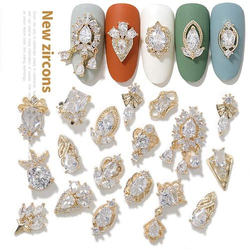 HNUIX Nail Charms and Gems - Gold Copper Zircon, Multiple Shapes 3D Dangle, Metal Jewelry Rhinestones for Nails 17 Pieces