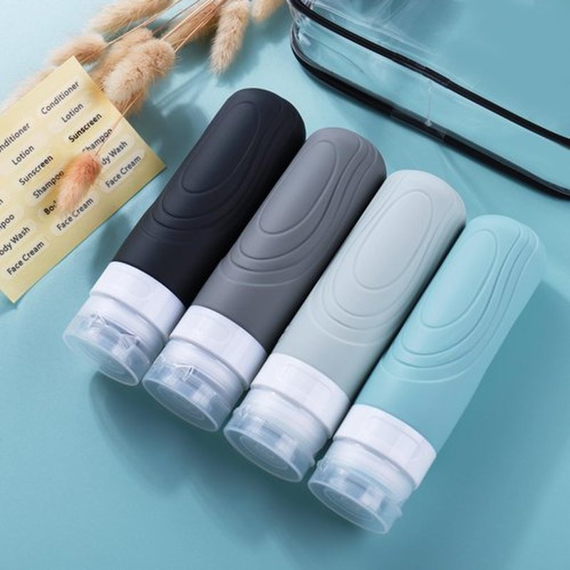 GLAMFIELDS Travel Bottles for Toiletries, TSA Approved 3oz Size Leak Proof Silicone Containers for Shampoo, Conditioner,Easy to Squeeze and Portable, Essentials for Traveling (4 Pack) Grey