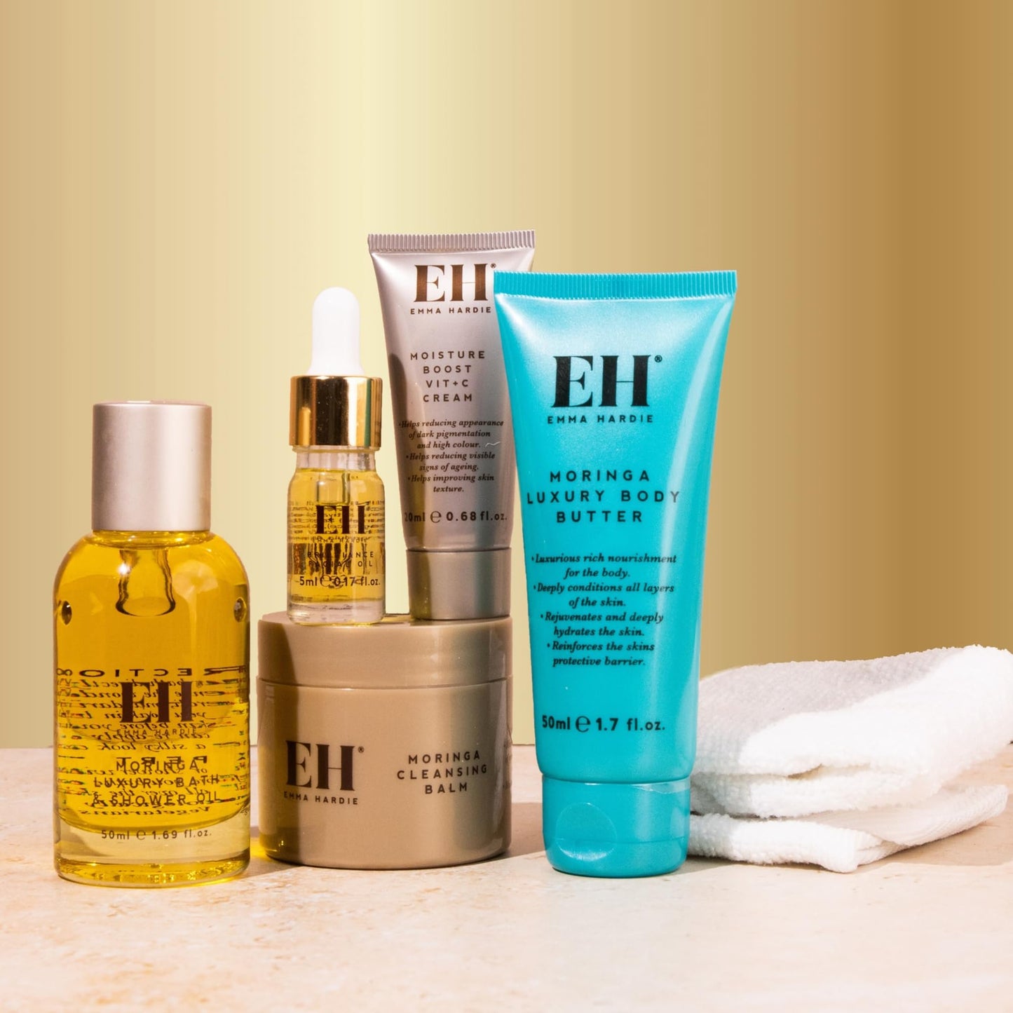 Emma Hardie 5pcs Amazing Travel Kit: 30ml Moringa Cleansing Balm, 50ml Moringa Luxury Bath & Shower oil, 50ml Moringa Luxury Body Butter, 20ml Moisture Boost Vit C Cream, 5ml Brilliance Facial Oil
