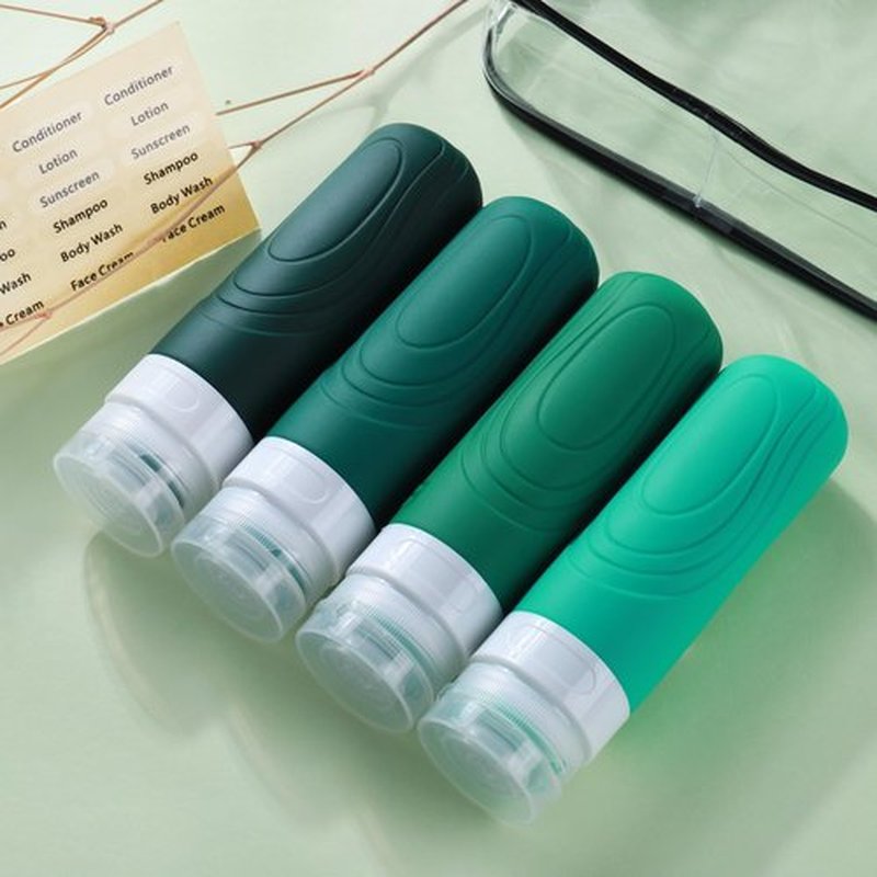 GLAMFIELDS Travel Bottles for Toiletries, 3oz Size TSA Approved Leak Proof Silicone Containers for Shampoo, Conditioner,Easy to Squeeze and Portable, Essentials for Traveling (4 Pack) Green