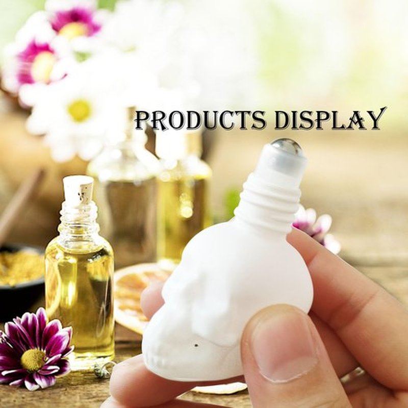 MINELEVEN 7 pcs Set 10ml Mini Skull Glass Oil Roller Bottles Leakproof Essential Oils Bottle for Storage and Travel (white)